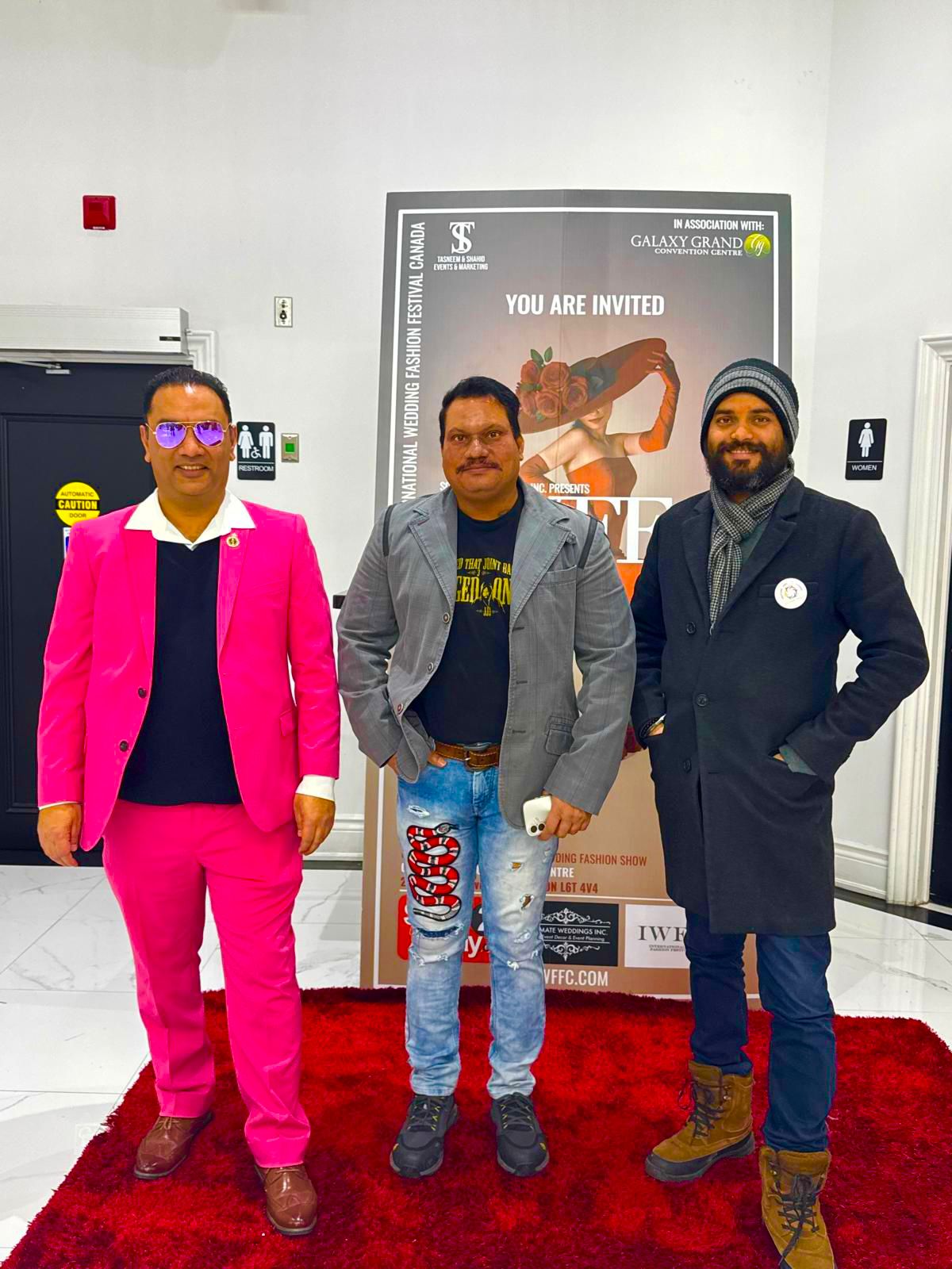 FXHollywood Films alongside guests at a poster backdrop